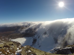 Sun warming a snowy mountain